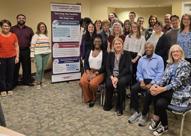 A diverse group of Network staff, partners, and subject matter experts pose for a group photo